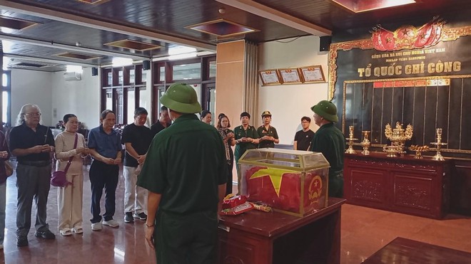 Lễ cất bốc và tiễn đưa hài cốt liệt sĩ về quê hương - Ảnh 2.