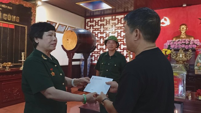 Lễ cất bốc và tiễn đưa hài cốt liệt sĩ về quê hương - Ảnh 3.