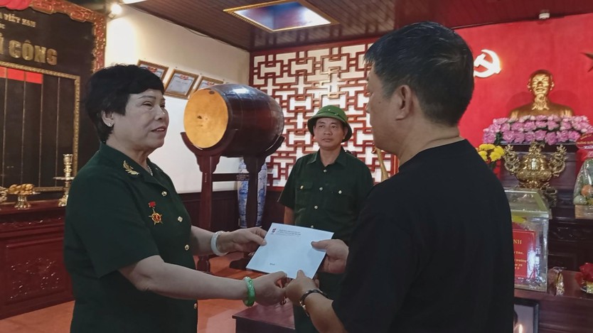 Lễ cất bốc và tiễn đưa hài cốt liệt sĩ về quê hương - Ảnh 3.