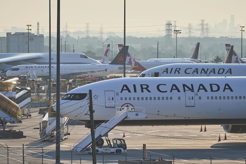 Chính phủ Canada yêu cầu Air Canada và các tiếp viên trở lại làm việc  - Ảnh 3.