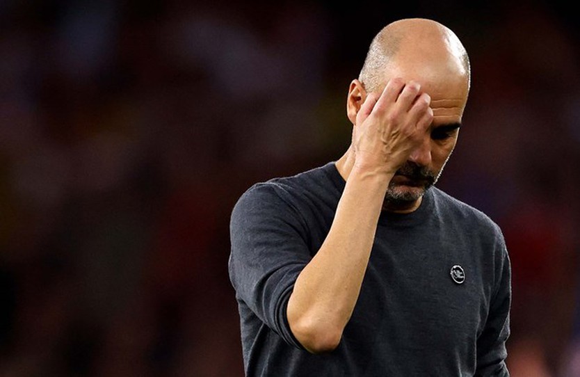 Pep Guardiola và các học trò cần cải thiện phong độ tại Premier League.  Ảnh: AFP 
